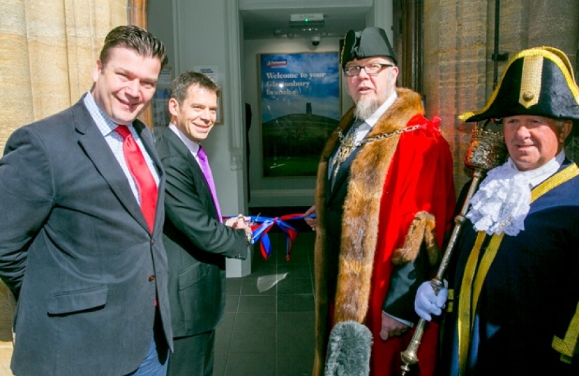 James Heappey MP, Joe Garner Nationwide's CEO and Jon Cousins, Mayor of Glastonbury cutting the ribbon